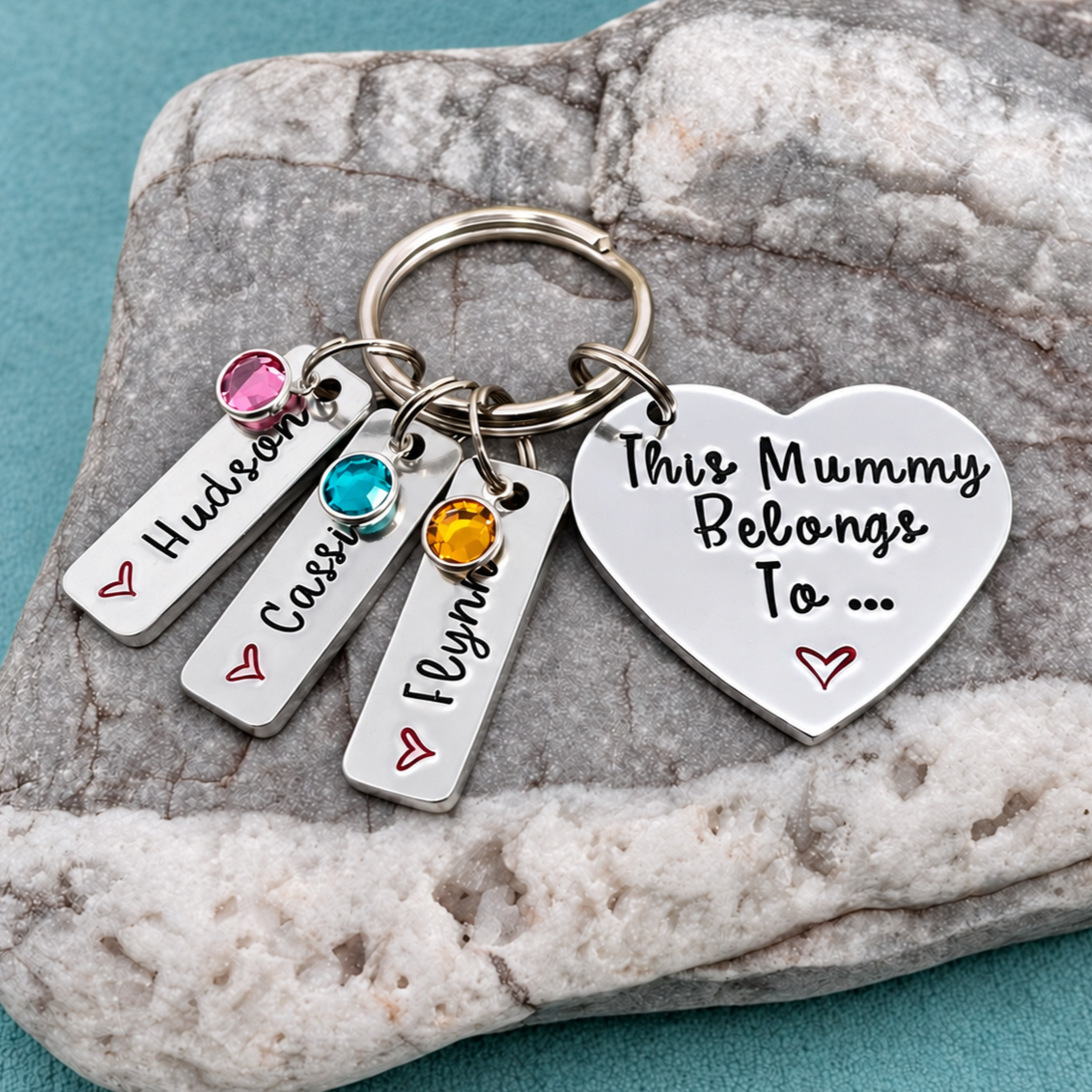 Personalised This Mummy Belongs To heart keyring with three rectangular name tags and colourful birthstone charms.