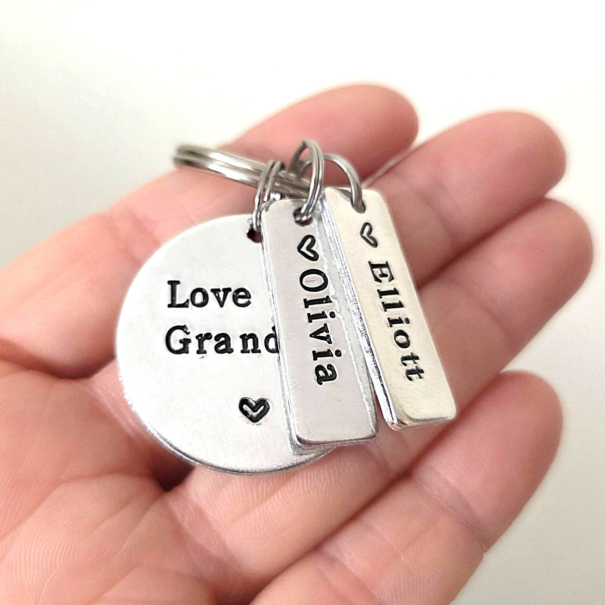 This Grandad Belongs To hand stamped aluminium keyring with round tag and name tags