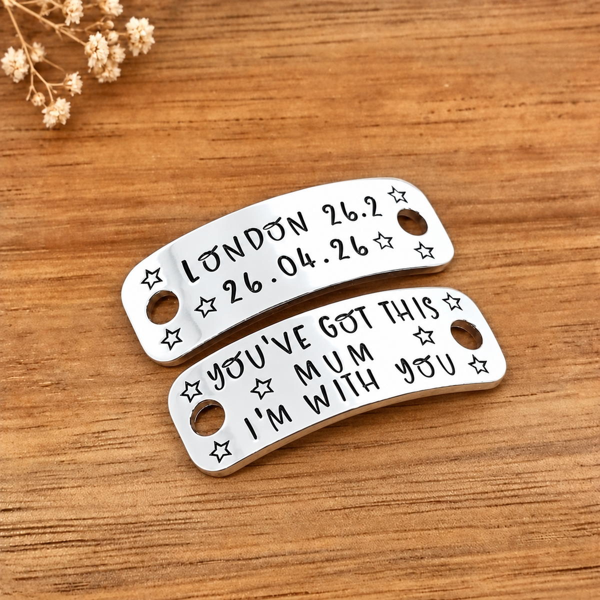 Personalised running shoe tags stamped London 26.2 and You’ve got this Mum, I’m with you, decorated with stars on wood
