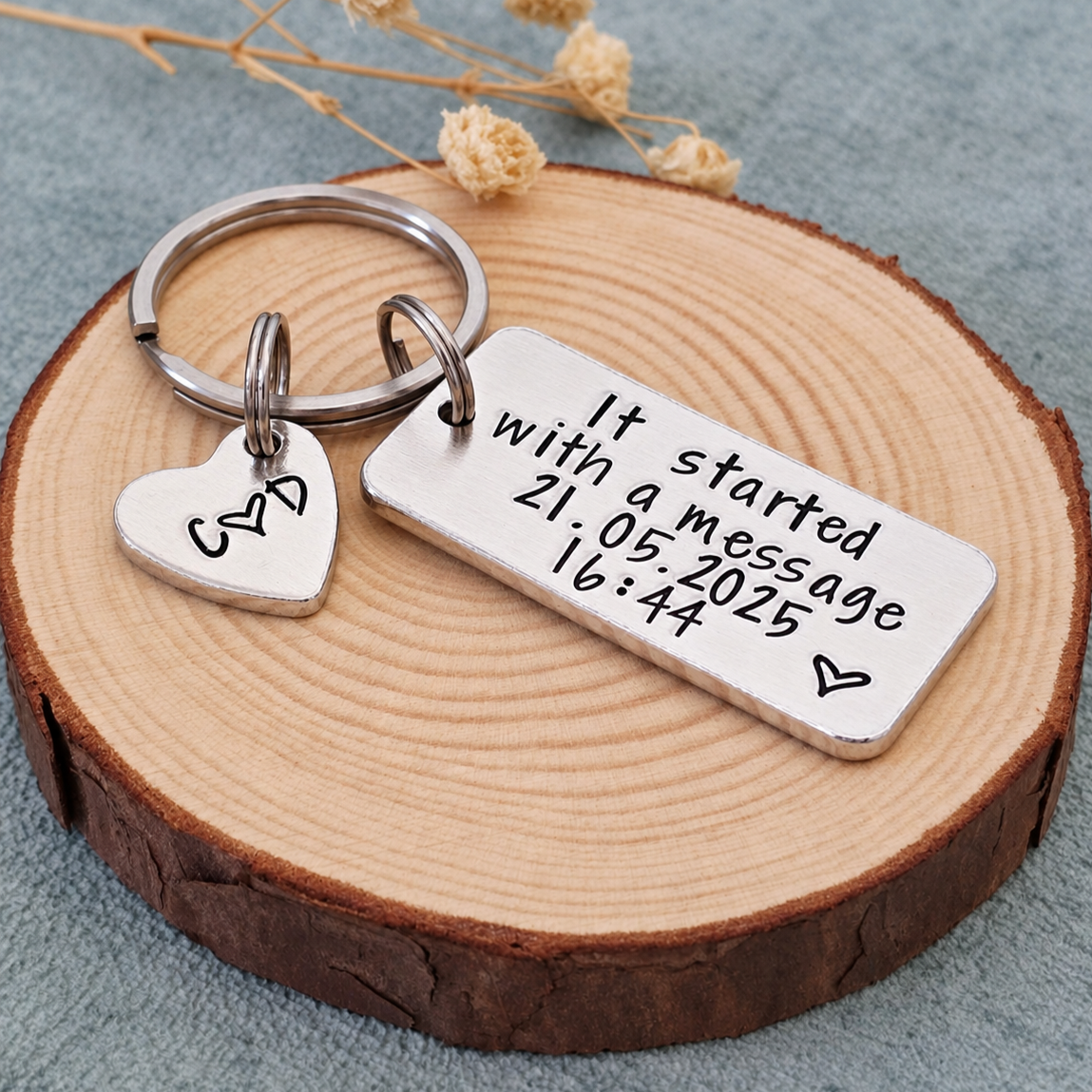 Personalised It Started With a Message keyring with a date, time and initial heart tag on a wood slice
