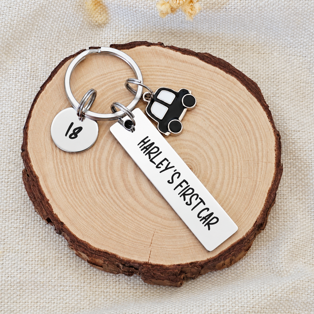 First car keyring engraved Harley's First Car with a round 18 tag on a wooden display