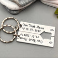 Personalised Our First Home keyring set with a shared house cut-out, date 19.01.2022 and initials B and C beside stacked stones
